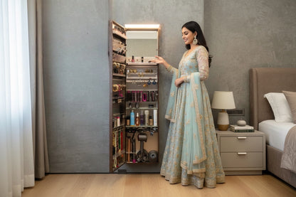 Vanitibox stainless steel makeup and jewelry armoire with internal mirror and organized storage. Features include earring, ring, necklace, and bottle compartments.